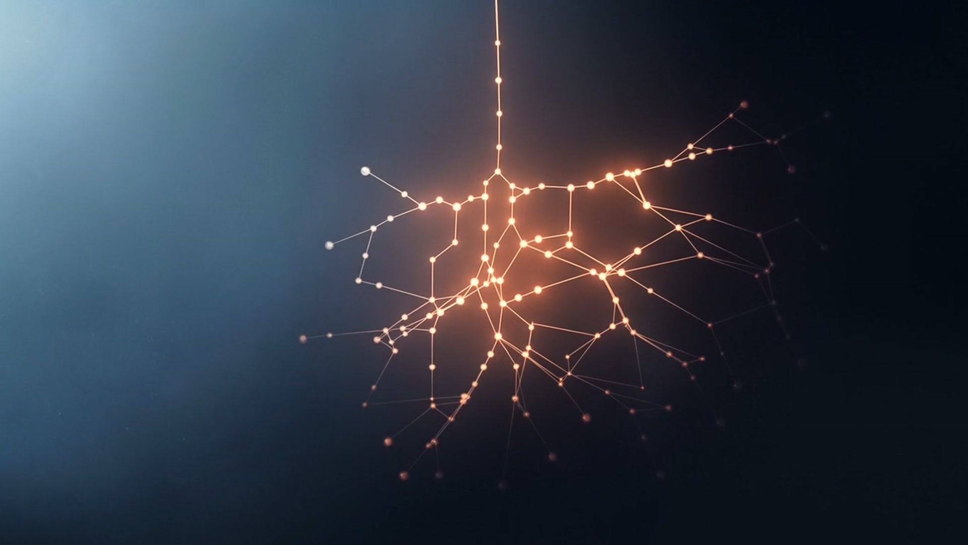 A thread of orange light branching into connected nodes in blue mist